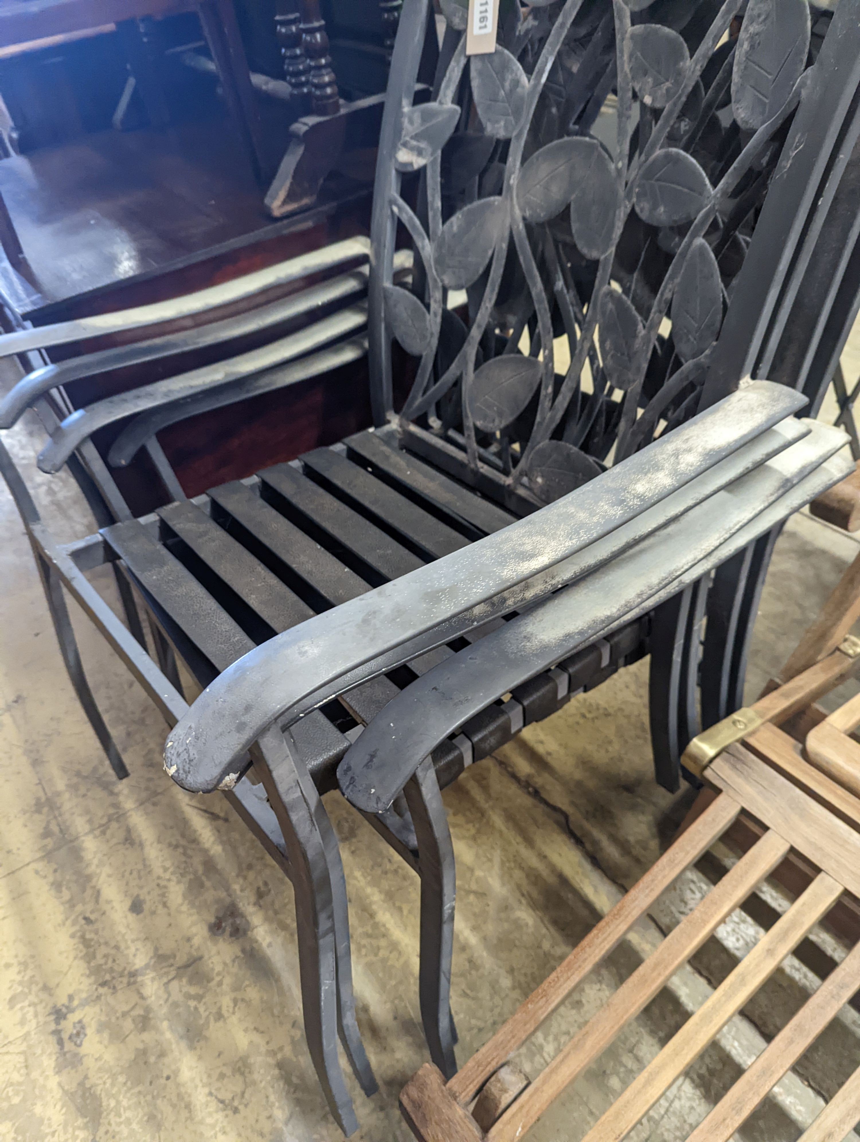 A set of four aluminium garden elbow chairs, width 62cm, depth 50cm, height 94cm